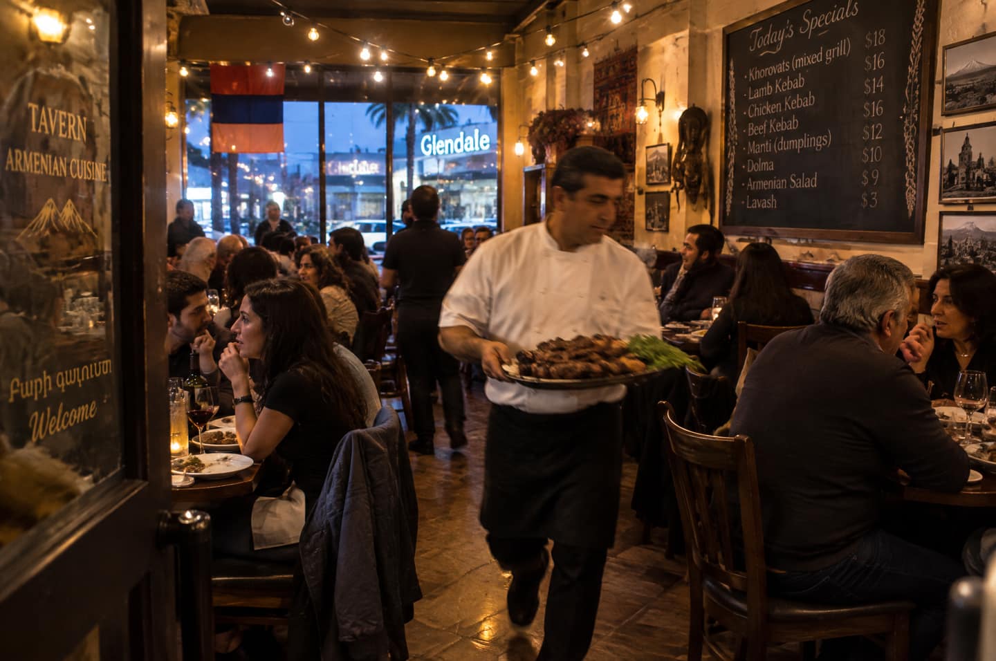 Opening night in a warm, crowded Armenian restaurant dining room